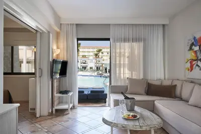 a living room with a couch and a table at Atlantica Aeneas Resort in Ayia Napa