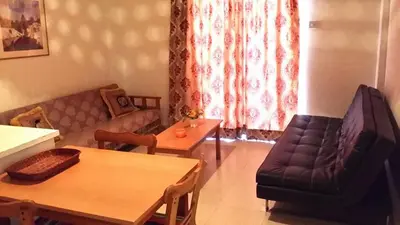 a living room with a couch and a table at Milounapa in Ayia Napa