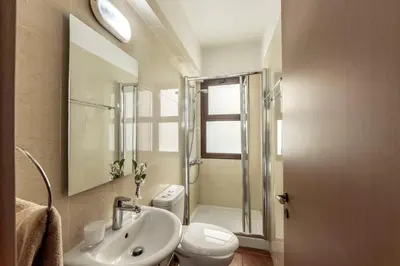 a bathroom with a sink and a toilet and a shower at Villa Ionion 27 in Ayia Napa