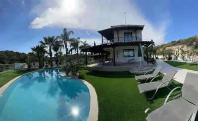 a resort with a swimming pool and a building at Leo's Paradise in Protaras