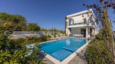 a swimming pool in the backyard of a house at Diamond villas in Protaras