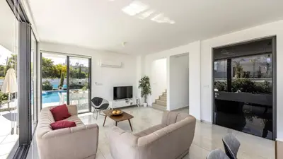 a living room with two couches and a television at Diamond villas in Protaras