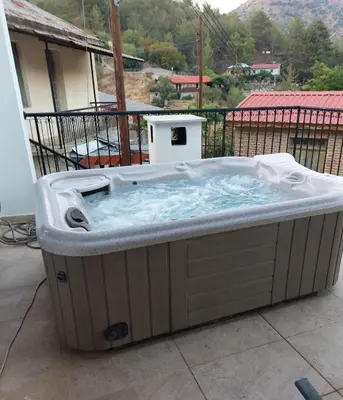 a hot tub on top of a balcony at Love Holiday Suite 1 in Tris Elies