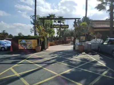 a parking lot with a sign for a car park at MERSINERA PARADISE GARDEN STARS HOUSE in Larnaka