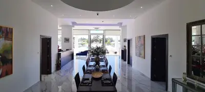a dining room with a long table in a building at MAXOR PALACE in Protaras
