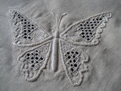 a butterfly applique on a piece of cloth at Our House in Vavla