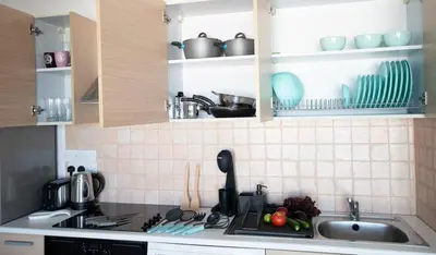 a kitchen with a sink and a counter top at Glabur Stays - The Sunny Atelier - Nicosia City, Free Parking & Wifi, Welcomes You!!! in Nicosia