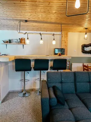 a living room with a couch and a bar at Milea Mansion in Limassol