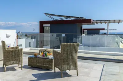two chairs and a table on a roof at Protaras Royal Pearl Villa 7 in Protaras