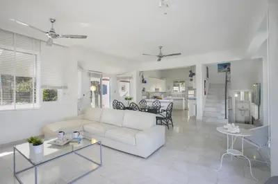 a living room with a white couch and a table at Villa in Ayia Napa with a pool! in Ayia Napa