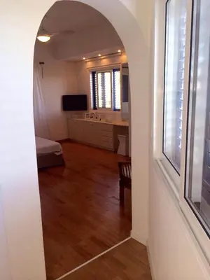 an archway in a room with a bedroom and a living room at Villa in Ayia Napa with a pool! in Ayia Napa