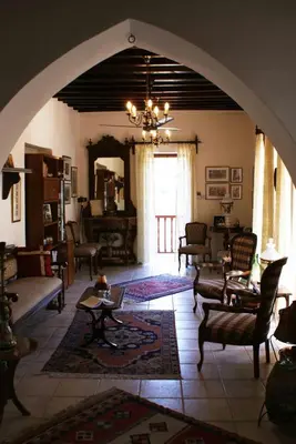 a large living room with an archway in a house at ATRATSA Mountain Suites in Kalopanayiotis