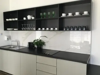 a kitchen with a sink and a counter top at A.V Central Apartment in Larnaka
