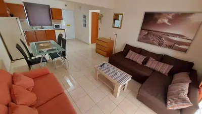 a living room with a couch and a table at Nissi Golden Sands Lome in Ayia Napa
