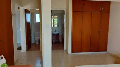 a bathroom with a sink and a toilet in a room at Nissi Golden Sands Lome in Ayia Napa