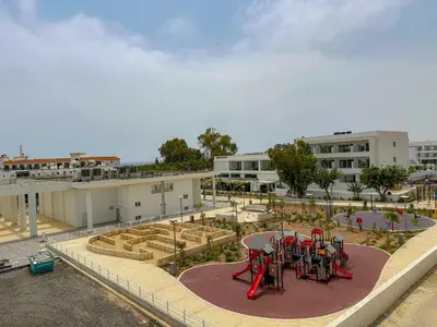 a park with a playground with tables and plants at Lovely Studio Ayia Napa in Ayia Napa