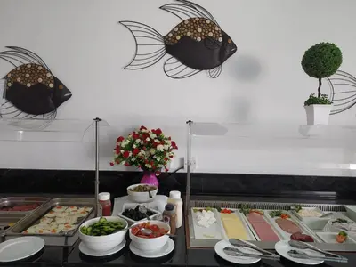a buffet with food on a table in a restaurant at Sunny Blue Hotel in Ayia Napa