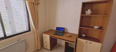a laptop computer sitting on a desk next to a window at STAY Swallow's Nest Villa in Ayia Napa
