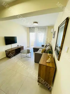 a living room with a couch and a table at Milos City Center Apts No.34 in Larnaka