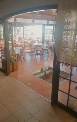 a view of a dining room with tables and chairs at Anais Bay Hotel in Protaras