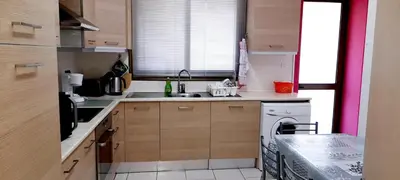 a small kitchen with a sink and a dishwasher at Apartment Sleeps 6 with Ensuite in Nicosia