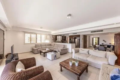 a large living room with couches and a table at Villa Adalia in Protaras
