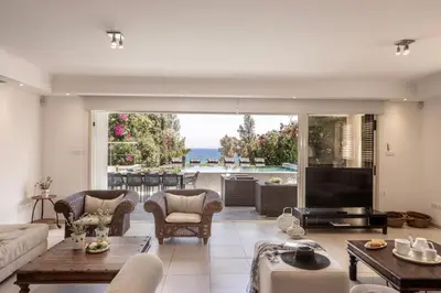 a living room with a view of the ocean at Villa Adalia in Protaras