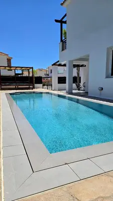 a swimming pool in front of a house at Sweet Destiny Villa with private pool in Ayia Napa