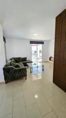 a living room with a couch and a table at Sweet Destiny Villa with private pool in Ayia Napa