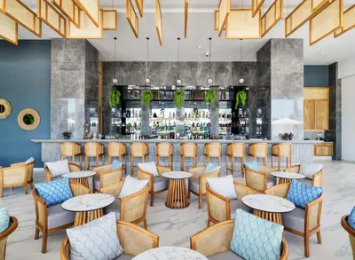 a restaurant with tables and chairs and a bar at Amanti, MadeForTwo Hotels - Ayia Napa in Ayia Napa