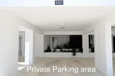 a room with white walls and a white ceiling at Golden Tree Apartment in Paralimni
