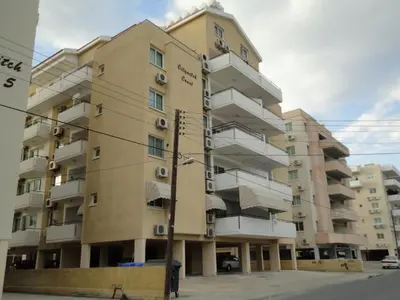 a building with balconies on the side of it at Apartments Mackenzie 1+1 in Larnaka