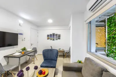 a living room with a couch and a table at C-Premium Apts 100m from beach and city centre in Larnaka