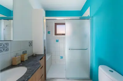 a bathroom with a shower and a sink at Protaras Villa Elena 3 in Protaras