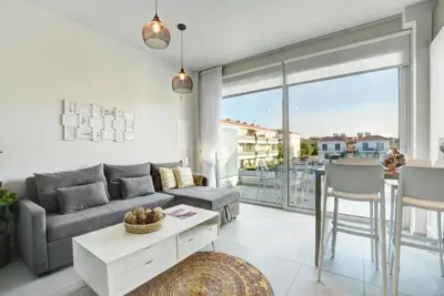 a living room with a couch and a table at SunnyVillas: NEW Studio SPA & GYM in Kapparis in Protaras