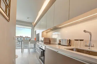 a kitchen with a sink and a counter at SunnyVillas: NEW Studio SPA & GYM in Kapparis in Protaras