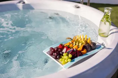 a tray of fruit sitting on top of a swimming pool at Atlantica Bay - Adults Only in Limassol