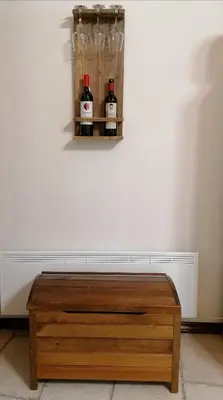 a table with two bottles of wine on a wall at House de Fountas in Khandria