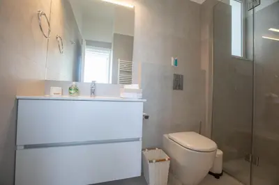 a bathroom with a toilet and a sink and a shower at Villa Olivine Pearl 3 in Protaras