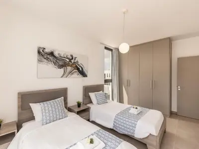 a bedroom with two beds in a room at Almaria Residences in Paralimni
