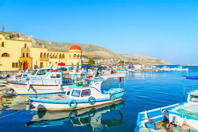 a group of boats are docked in a harbor at Mimi's Sunny Beach Apartment in Larnaka