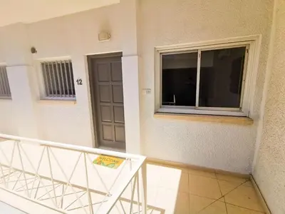 a balcony with a door and a window at FlipFlop City Center Apartment in Larnaka