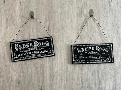 two signs are hanging on a wall at Lovely 1-bd apt with patio in Nicosia center in Nicosia