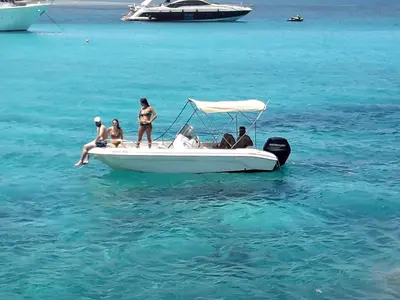 a group of people on a boat in the water at SEAFRONT BEACH PARTY VILLA in Pervolia
