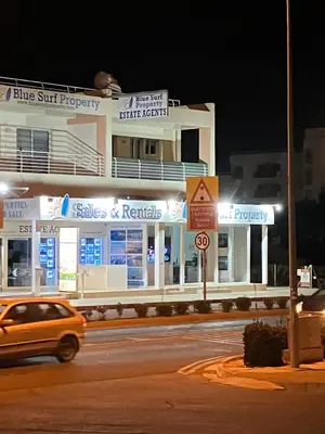 a car driving down a street in front of a building at Protaras, Janas apartment in Protaras