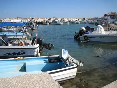 a group of boats are docked in a marina at Trident Beach Apartment in Protaras