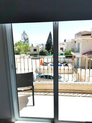 a view of a patio from a sliding glass door at Villa Alba, Luxury 4 BDRM Villa with Heated Pool in Protaras