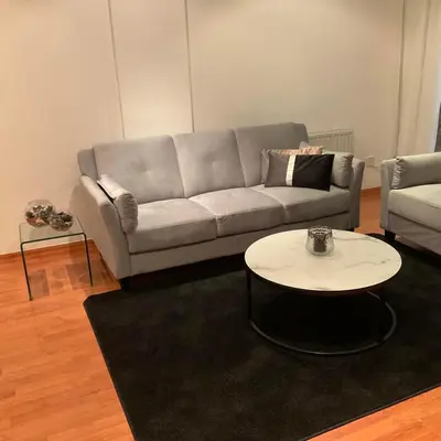 a living room with a couch and a table at StayCity Flat!!! in Nicosia