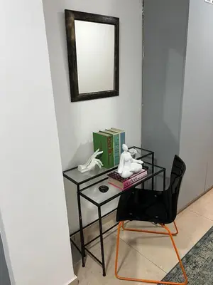 a black desk with a chair and a mirror at ARTEMIS 1 Bdr Down Town Nicosia in Nicosia