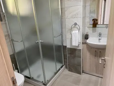 a bathroom with a shower and a sink at Modern City Center Apartment Saripolou 2 in Limassol